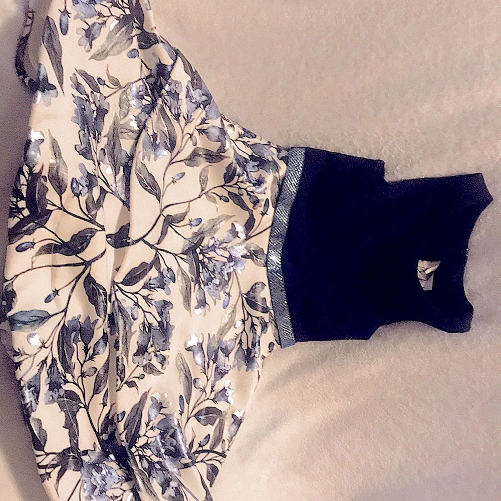 Blue and white formal dress with floral design.